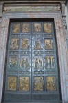 The northernmost door is the "Holy Door" which, by tradition, is walled-up with bricks, and opened only for holy years such as the Jubilee year by the Pope. The present door is bronze and was designed by Vico Consorti in 1950. Above it are inscriptions commemorating the opening of the door: PAVLVS V PONT MAX ANNO XIII and GREGORIVS XIII PONT MAX. Recent commemorative plaques read: PAVLVS VI PONT MAX HVIVS PATRIARCALIS VATICANAE BASILICAE PORTAM SANCTAM APERVIT ET CLAVSIT ANNO IVBILAEI MCMLXXV Paul VI, Pontifex Maximus, opened and closed the holy door of this patriarchal Vatican basilica in the jubilee year of 1975. IOANNES PAVLVS II P.M. PORTAM SANCTAM ANNO IVBILAEI MCMLXXVI A PAVLO PP VI RESERVATAM ET CLAVSAM APERVIT ET CLAVSIT ANNO IVB HVMANE REDEMP MCMLXXXIII – MCMLXXXIV John Paul II, Pontifex Maximus, opened and closed again the holy door closed and set apart by Paul VI in 1976 in the jubilee year of human redemption 1983-4. IOANNES PAVLVS II P.M. ITERVM PORTAM SANCTAM APERVIT ET CLAVSIT ANNO MAGNI IVBILAEI AB INCARNATIONE DOMINI MM-MMI John Paul II, Pontifex Maximus, again opened and closed the holy door in the year of the great jubilee, from the incarnation of the Lord 2000–2001.